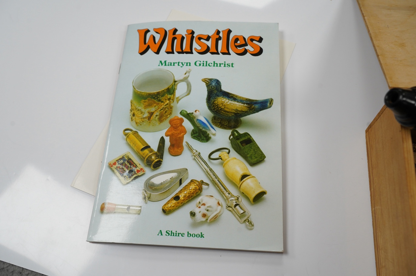 A collection of whistles including a horn example, a tin whistle, novelty bird whistles, etc. Condition - fair